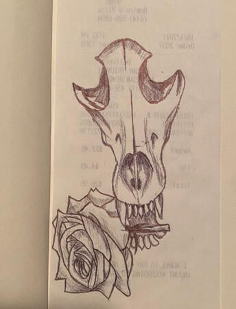 Wolf skull with rose